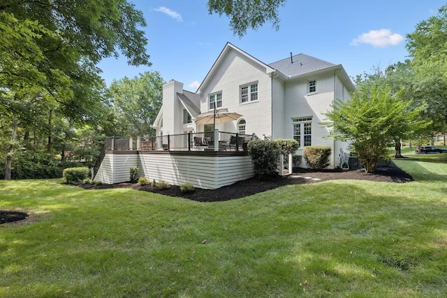 1060 Wilshire Way, Brentwood, TN 37027 - rear view of house with a wooden deck, a lawn, and a chimney