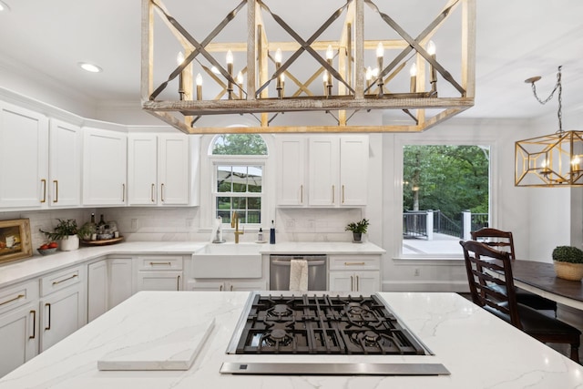 1060 Wilshire Way, Brentwood, TN 37027 - kitchen featuring a chandelier, stainless steel dishwasher, gas cooktop, white cabinetry, and decorative backsplash