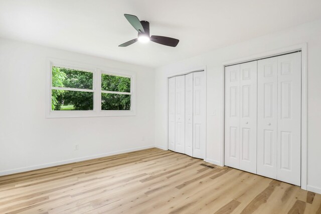 107 Hillsdale Dr, Hendersonville, TN 37075 - unfurnished bedroom with multiple closets, light wood-type flooring, and a ceiling fan