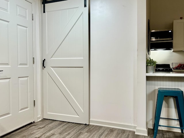 1307 Tomahawk Trce, Murfreesboro, TN 37129 - detailed view of wood finished floors and a barn door