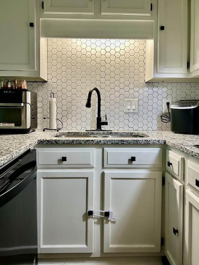 1307 Tomahawk Trce, Murfreesboro, TN 37129 - kitchen with dishwasher, backsplash, and light stone counters