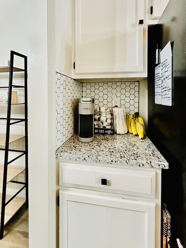 1307 Tomahawk Trce, Murfreesboro, TN 37129 - kitchen featuring freestanding refrigerator, white cabinets, and decorative backsplash