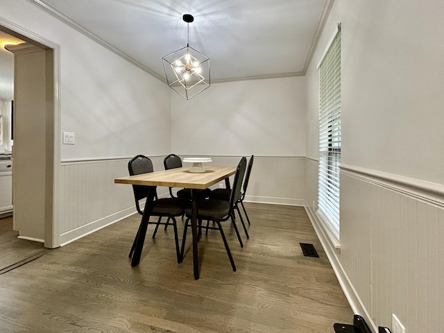 1307 Tomahawk Trce, Murfreesboro, TN 37129 - dining area with a wainscoted wall, ornamental molding, dark wood-style floors, and a chandelier