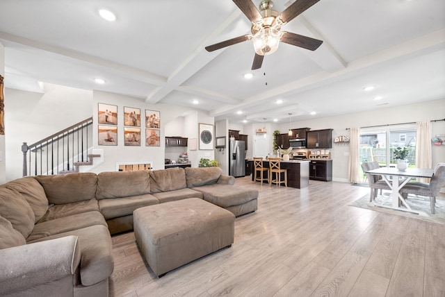 1098 Eagles View Dr, Clarksville, TN 37040 - living room featuring recessed lighting, beamed ceiling, stairway, a ceiling fan, and light wood finished floors