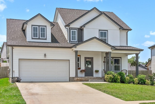1098 Eagles View Dr, Clarksville, TN 37040 - view of front of home with concrete driveway, covered porch, a shingled roof, and a garage