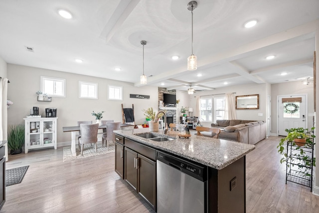 1098 Eagles View Dr, Clarksville, TN 37040 - kitchen with dishwasher, a ceiling fan, a stone fireplace, light stone counters, and recessed lighting
