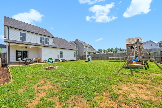 1098 Eagles View Dr, Clarksville, TN 37040 - fenced backyard with a fire pit, a playground, a patio, and ceiling fan