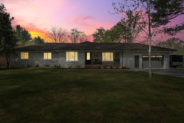 2913 New Hope Rd, Hendersonville, TN 37075 - ranch-style house with an attached garage, a porch, asphalt driveway, a front lawn, and brick siding