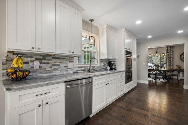 2913 New Hope Rd, Hendersonville, TN 37075 - kitchen featuring stainless steel appliances, dark wood-type flooring, white cabinetry, light stone countertops, and recessed lighting