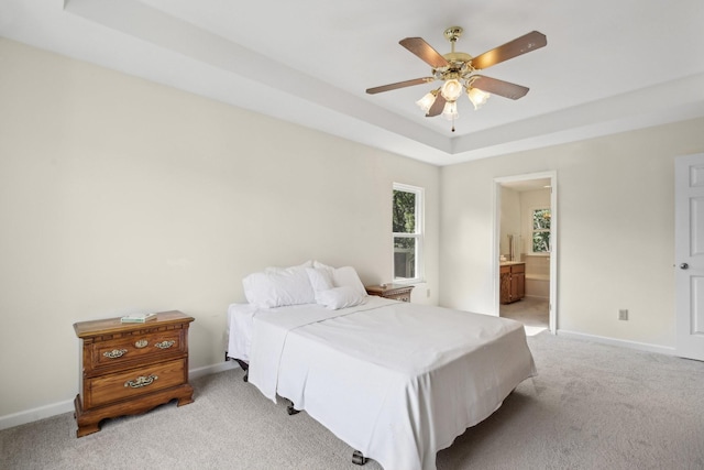 1438 Brighton Cir, Old Hickory, TN 37138 - bedroom with light colored carpet, a tray ceiling, ensuite bathroom, and ceiling fan