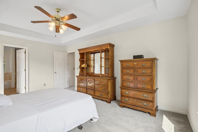 1438 Brighton Cir, Old Hickory, TN 37138 - bedroom featuring a raised ceiling, light colored carpet, ensuite bath, and a ceiling fan