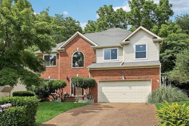 1438 Brighton Cir, Old Hickory, TN 37138 - traditional-style home featuring concrete driveway, brick siding, an attached garage, and a shingled roof