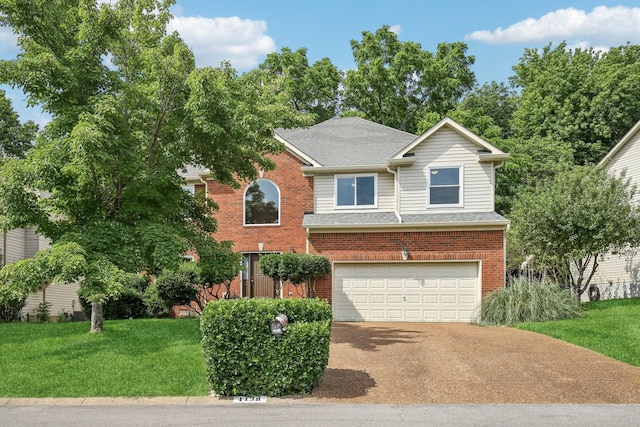 1438 Brighton Cir, Old Hickory, TN 37138 - traditional-style house with driveway, a garage, a front lawn, roof with shingles, and brick siding