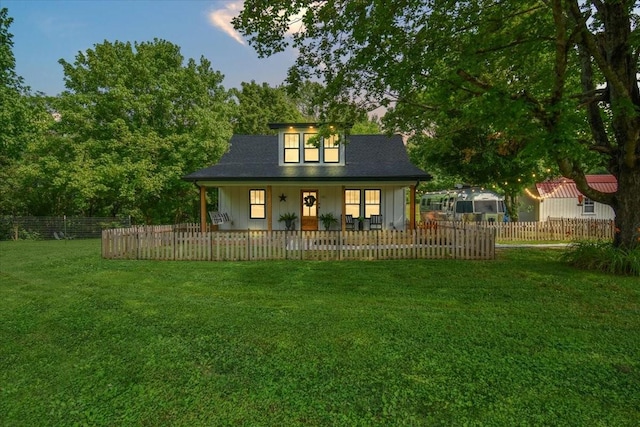 145 W Hollis Chapel Rd, Portland, TN 37148 - rear view of property with a porch, a fenced front yard, and board and batten siding