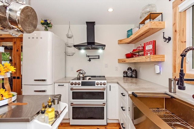 145 W Hollis Chapel Rd, Portland, TN 37148 - kitchen with wall chimney exhaust hood, white appliances, white cabinets, recessed lighting, and open shelves
