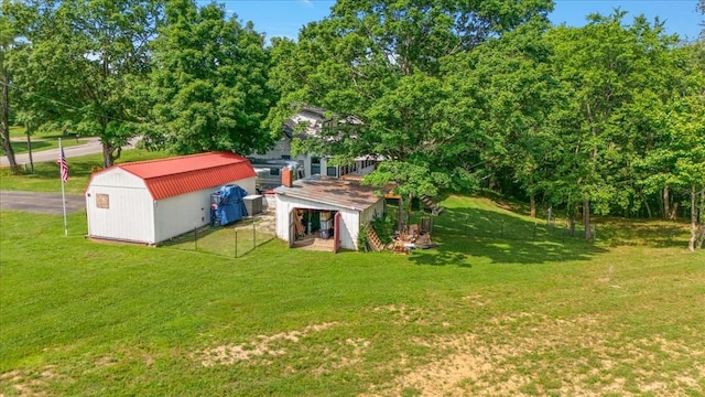 145 W Hollis Chapel Rd, Portland, TN 37148 - view of green lawn featuring a storage unit and view of scattered trees