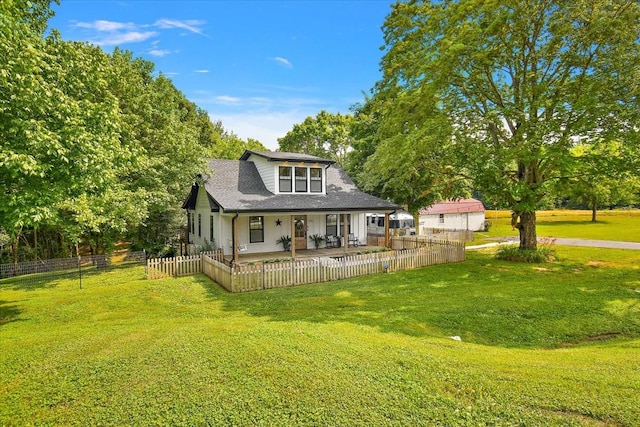 145 W Hollis Chapel Rd, Portland, TN 37148 - rear view of house with covered porch, a shingled roof, and view of scattered trees