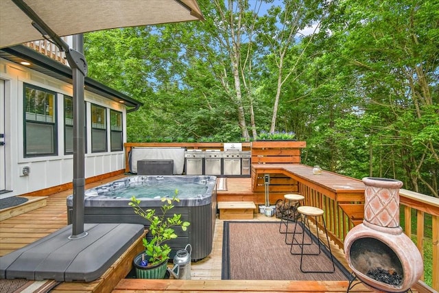 145 W Hollis Chapel Rd, Portland, TN 37148 - wooden deck featuring a hot tub and view of wooded area