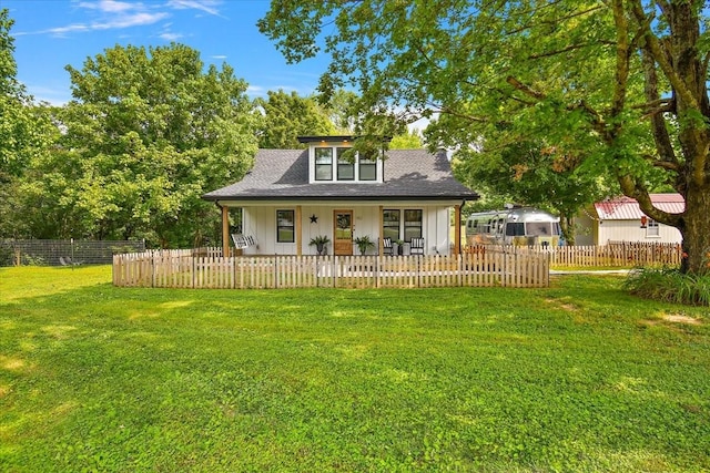 145 W Hollis Chapel Rd, Portland, TN 37148 - view of front of house with a porch, a fenced front yard, a shingled roof, and board and batten siding