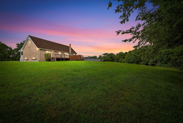2430 Underwood Rd, Cunningham, TN 37052 - yard at dusk with a lawn and a deck