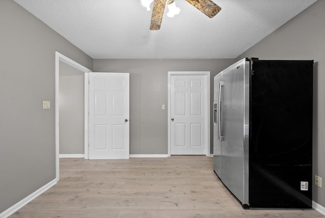 2430 Underwood Rd, Cunningham, TN 37052 - kitchen featuring stainless steel fridge, a ceiling fan, light wood finished floors, and a textured ceiling