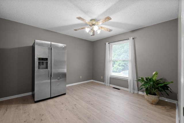 2430 Underwood Rd, Cunningham, TN 37052 - kitchen with stainless steel fridge with ice dispenser, ceiling fan, light wood-style floors, and a textured ceiling