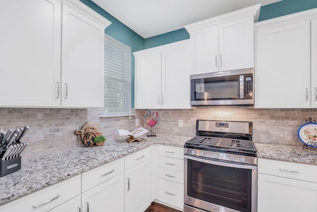 625 Foster Ln, Mount Juliet, TN 37122 - kitchen featuring stainless steel appliances, white cabinets, and tasteful backsplash