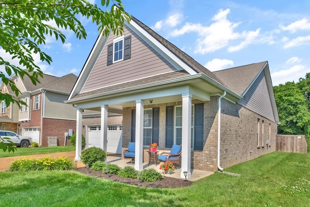 625 Foster Ln, Mount Juliet, TN 37122 - view of front facade featuring a porch, brick siding, and a garage