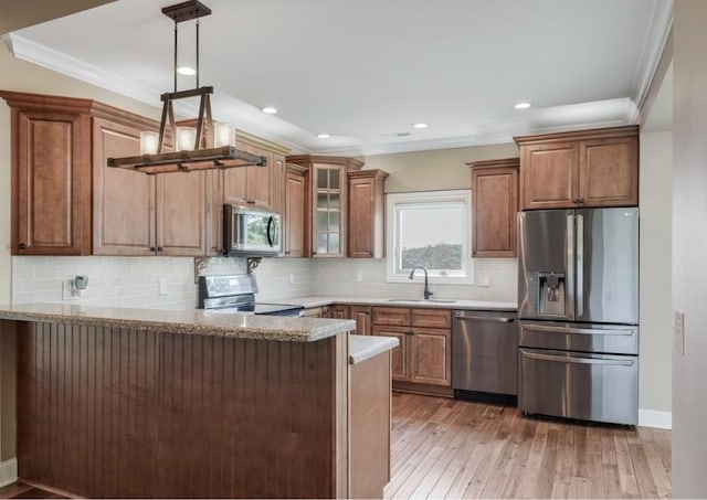 133 Tanasi Shr, Gallatin, TN 37066 - kitchen with appliances with stainless steel finishes, light wood-style flooring, a peninsula, glass insert cabinets, and light stone counters