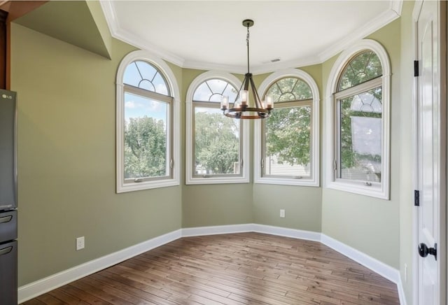133 Tanasi Shr, Gallatin, TN 37066 - unfurnished dining area with a chandelier, crown molding, healthy amount of natural light, and wood-type flooring