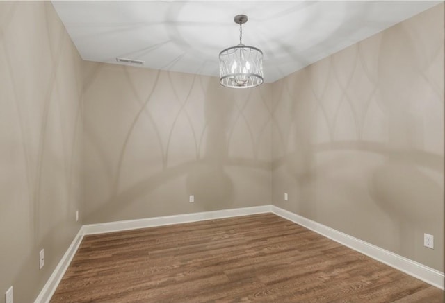 133 Tanasi Shr, Gallatin, TN 37066 - spare room with wood finished floors and a chandelier