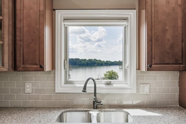 133 Tanasi Shr, Gallatin, TN 37066 - kitchen featuring decorative backsplash and light stone counters