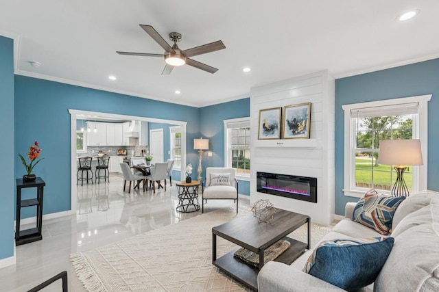 148 Quita Cir, Lebanon, TN 37087 - living room with ornamental molding, ceiling fan, a glass covered fireplace, recessed lighting, and light tile patterned floors