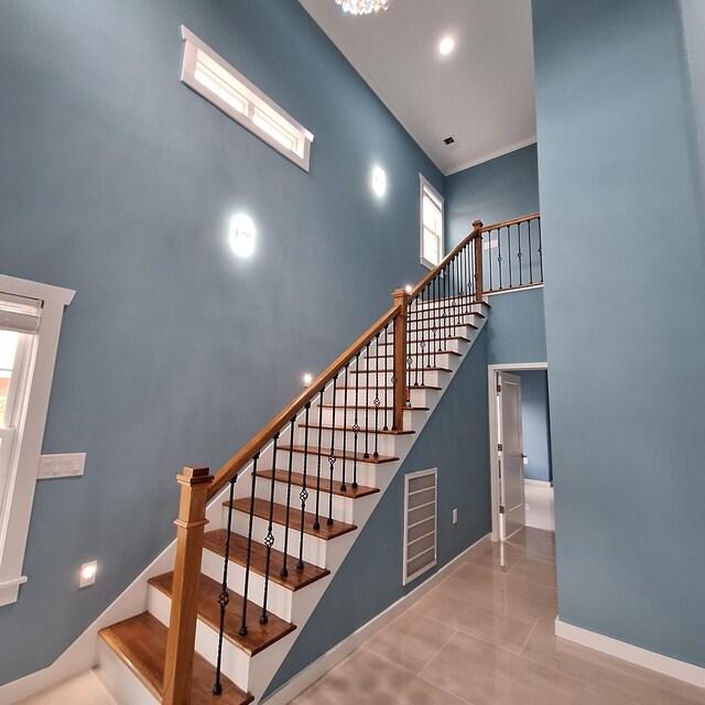 148 Quita Cir, Lebanon, TN 37087 - staircase with a high ceiling, plenty of natural light, and tile patterned floors