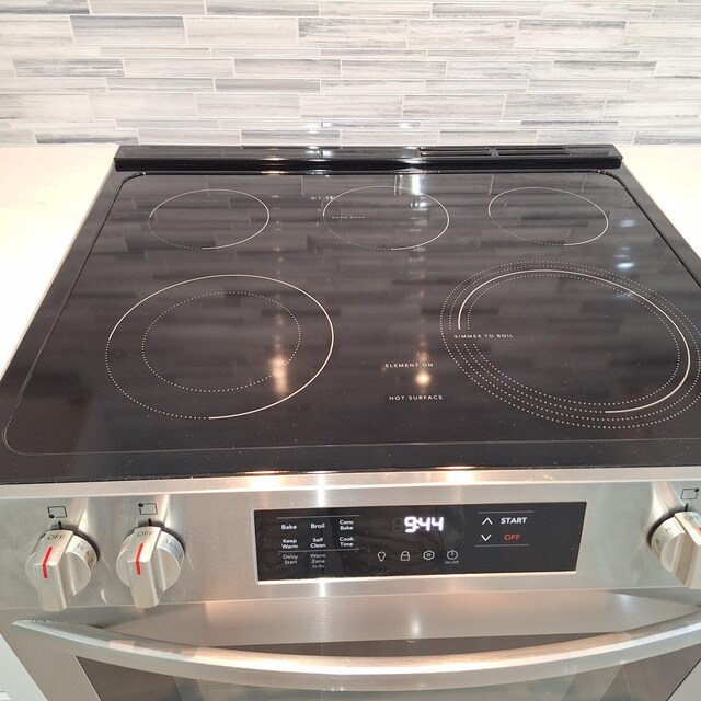 148 Quita Cir, Lebanon, TN 37087 - detailed view of stainless steel range with electric cooktop and backsplash