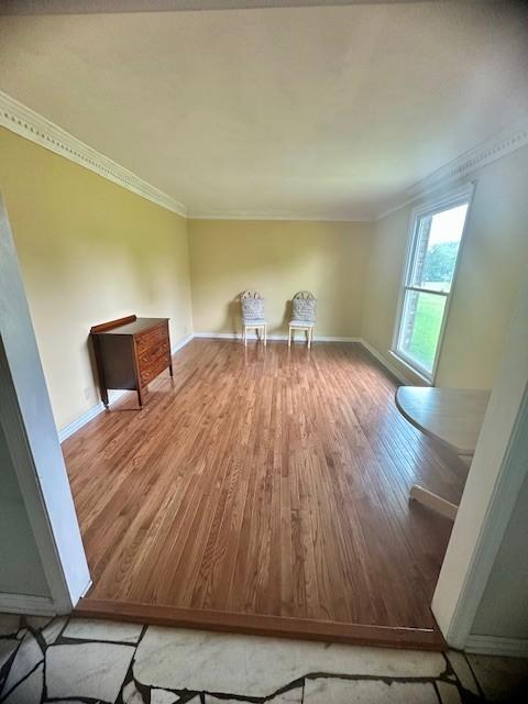 303 Revere Ln, Franklin, TN 37064 - unfurnished living room featuring wood finished floors and ornamental molding