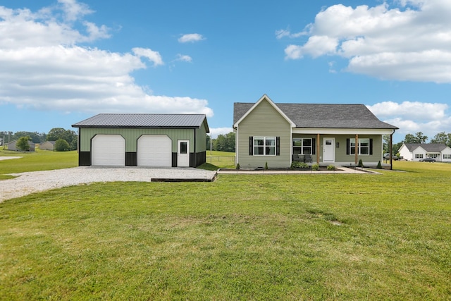 1202 Oak Grove Rd, Dickson, TN 37055 - ranch-style house featuring a detached garage, an outdoor structure, a front lawn, and covered porch
