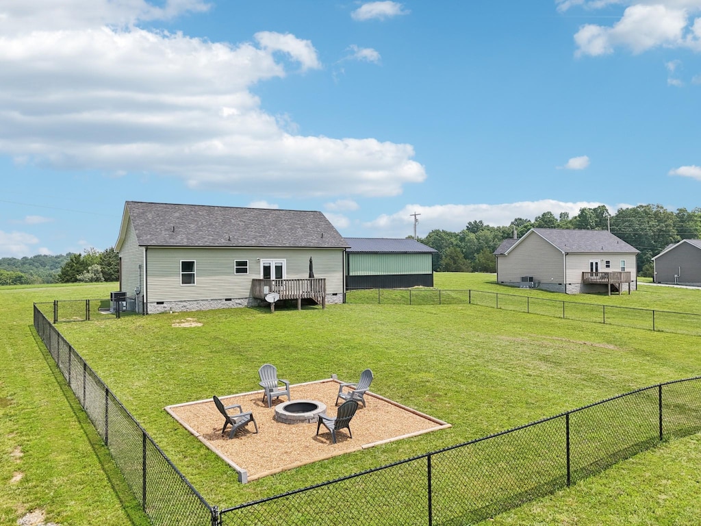 1202 Oak Grove Rd, Dickson, TN 37055 - fenced backyard with an outdoor fire pit and a deck