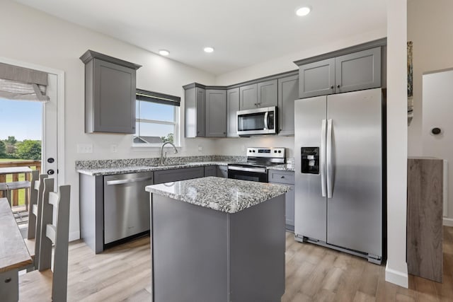 1202 Oak Grove Rd, Dickson, TN 37055 - kitchen featuring appliances with stainless steel finishes, gray cabinets, light wood-style flooring, and recessed lighting