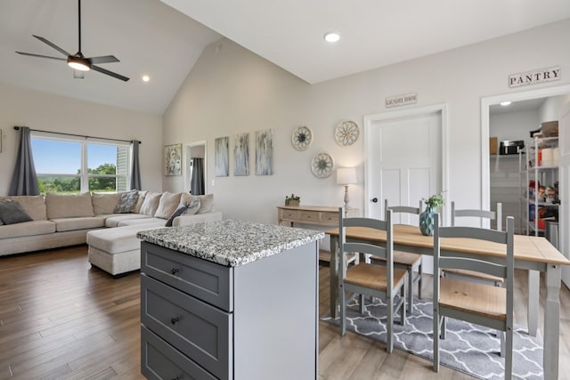 1202 Oak Grove Rd, Dickson, TN 37055 - kitchen with gray cabinetry, ceiling fan, high vaulted ceiling, a center island, and open floor plan
