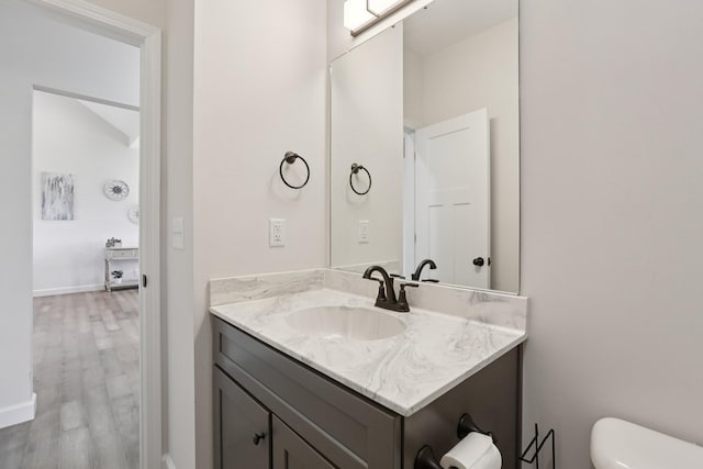 1202 Oak Grove Rd, Dickson, TN 37055 - half bathroom featuring vanity and wood finished floors