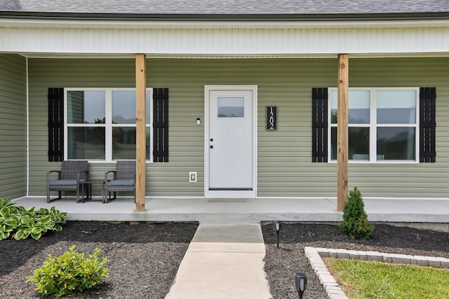 1202 Oak Grove Rd, Dickson, TN 37055 - view of exterior entry with a porch and a shingled roof
