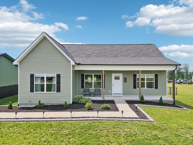 1202 Oak Grove Rd, Dickson, TN 37055 - view of front of home featuring covered porch, a front lawn, and a shingled roof