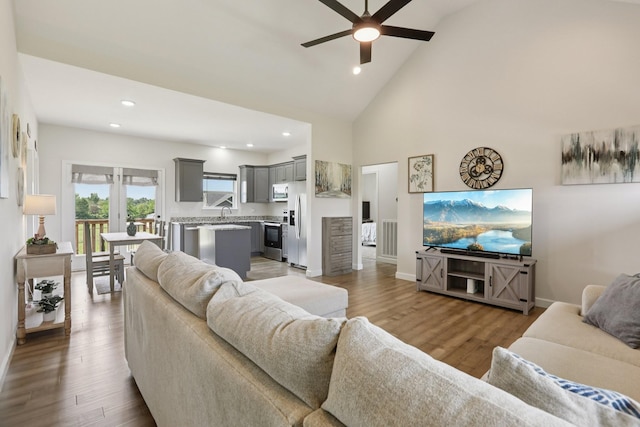 1202 Oak Grove Rd, Dickson, TN 37055 - living room featuring a ceiling fan, recessed lighting, high vaulted ceiling, and wood finished floors