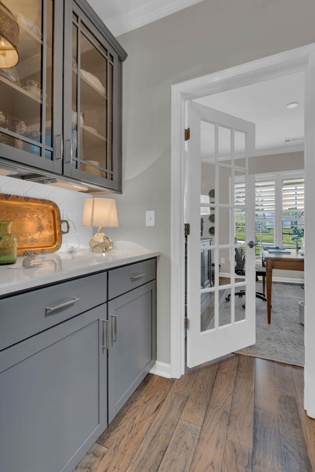 3002 Obion Pass, Spring Hill, TN 37174 - bar featuring ornamental molding, wood finished floors, and french doors