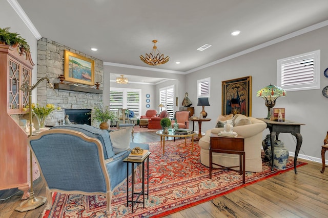 3002 Obion Pass, Spring Hill, TN 37174 - living room featuring crown molding, hardwood / wood-style flooring, a stone fireplace, and recessed lighting