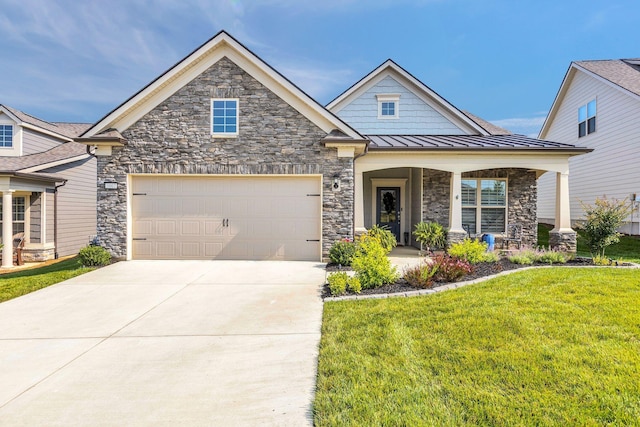3002 Obion Pass, Spring Hill, TN 37174 - craftsman house featuring stone siding, a front lawn, a standing seam roof, and driveway
