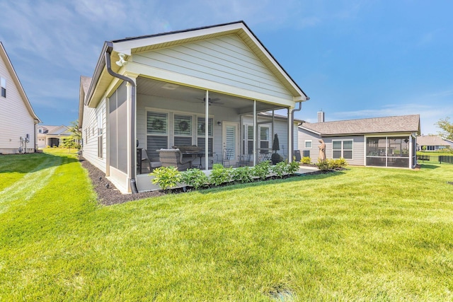 3002 Obion Pass, Spring Hill, TN 37174 - back of property featuring a sunroom, a yard, ceiling fan, and a patio area