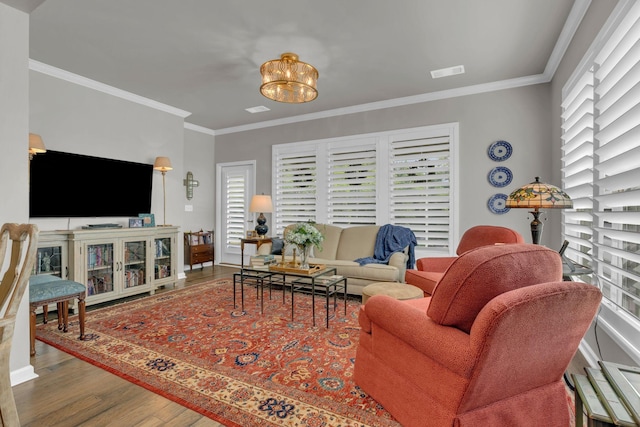 3002 Obion Pass, Spring Hill, TN 37174 - living room with wood finished floors, crown molding, plenty of natural light, and a chandelier