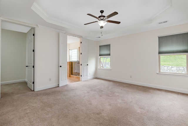 76 Molly Bright Ln, Franklin, TN 37064 - unfurnished bedroom with a raised ceiling, crown molding, light carpet, and a walk in closet